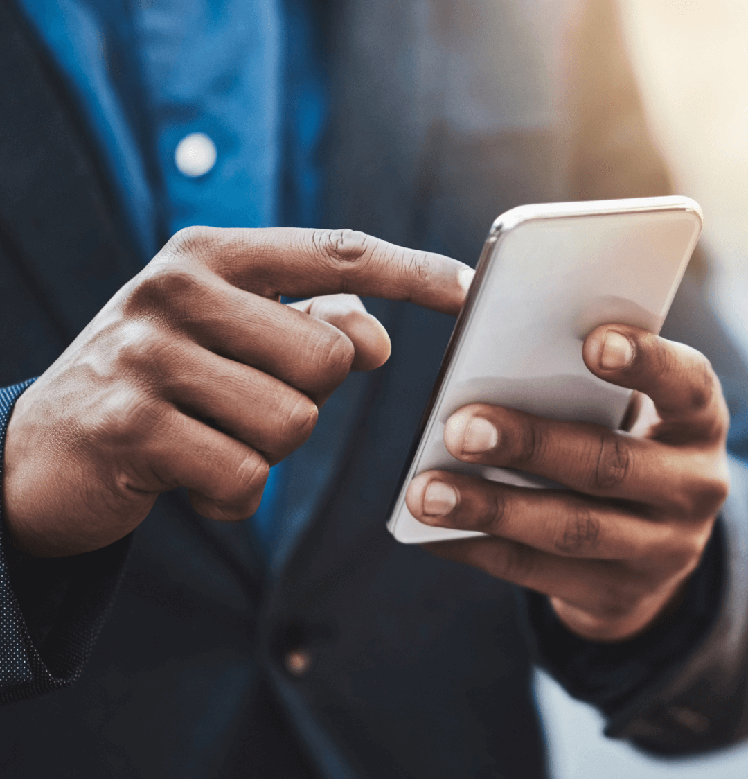 Man taps open real estate SMS message on smartphone